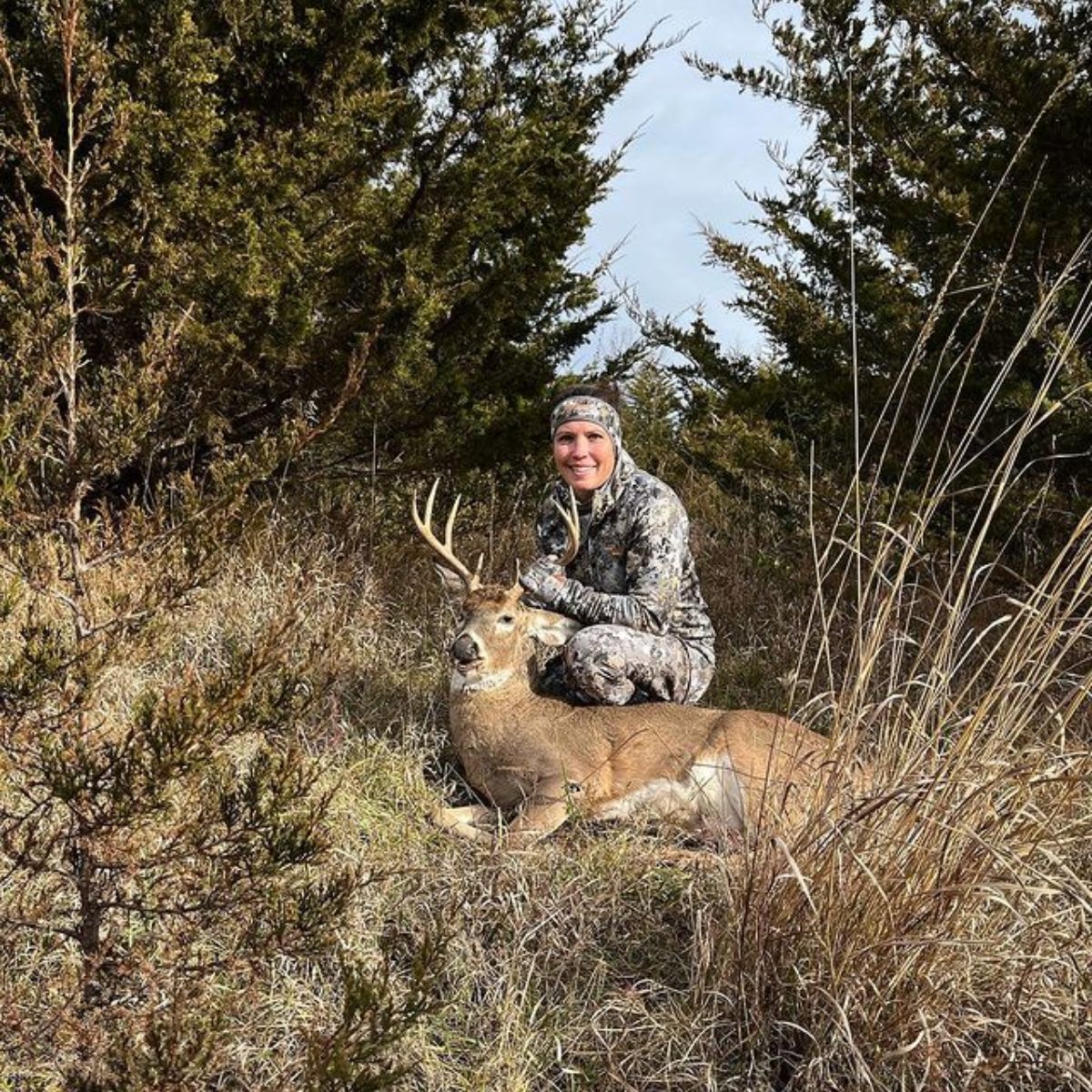 Photo of Sarah Lacina after hunting a deer.